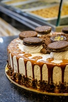 A decadent dessert featuring a slice of moist cake with a drizzle of chocolate sauce.