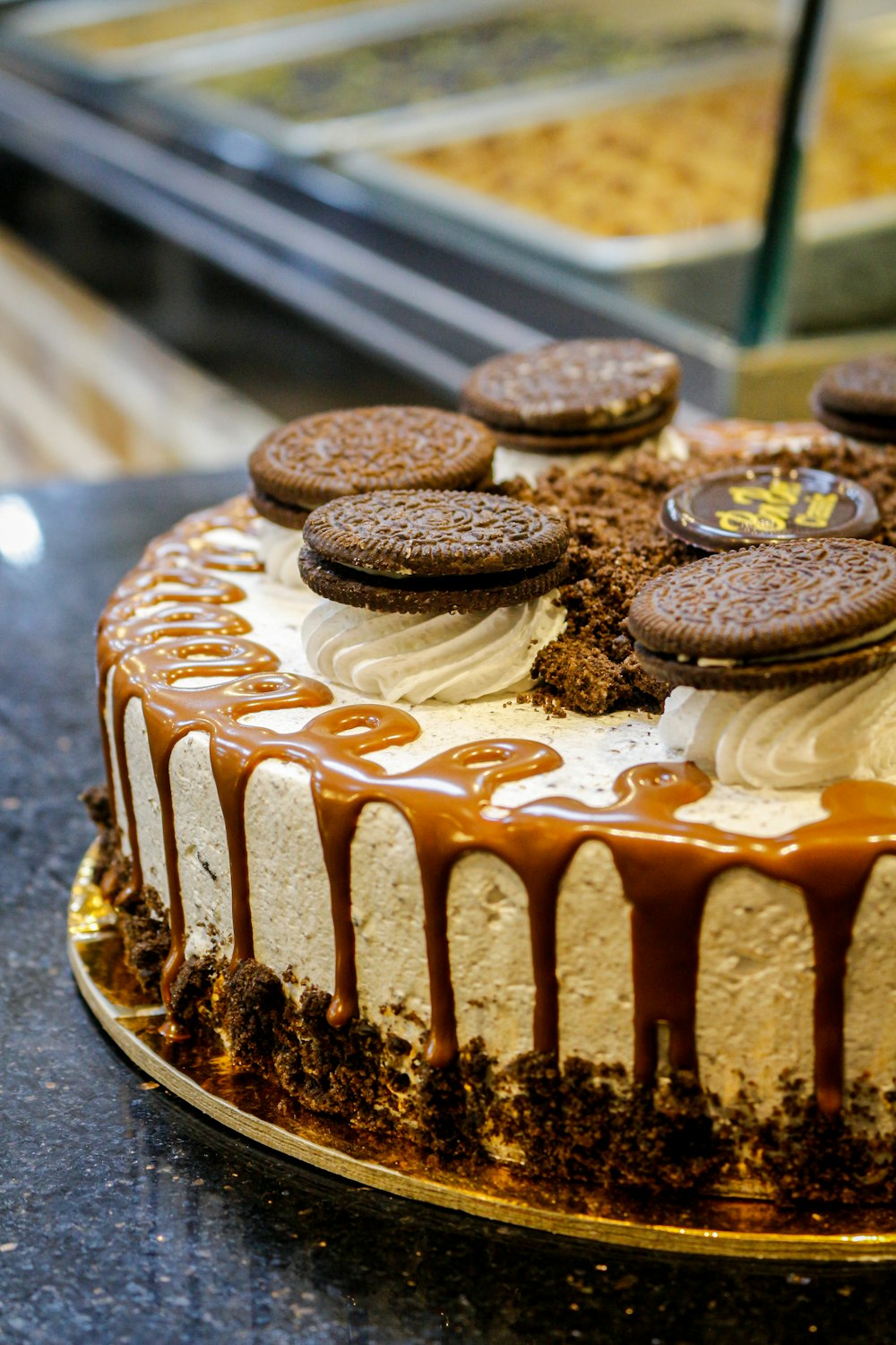 a cake with cookies on top of it on a table