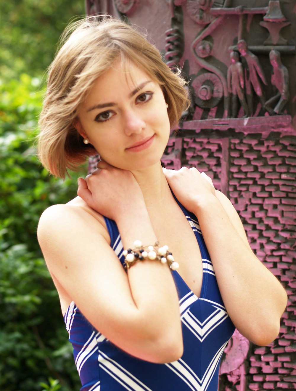 a woman in a blue dress posing for a picture