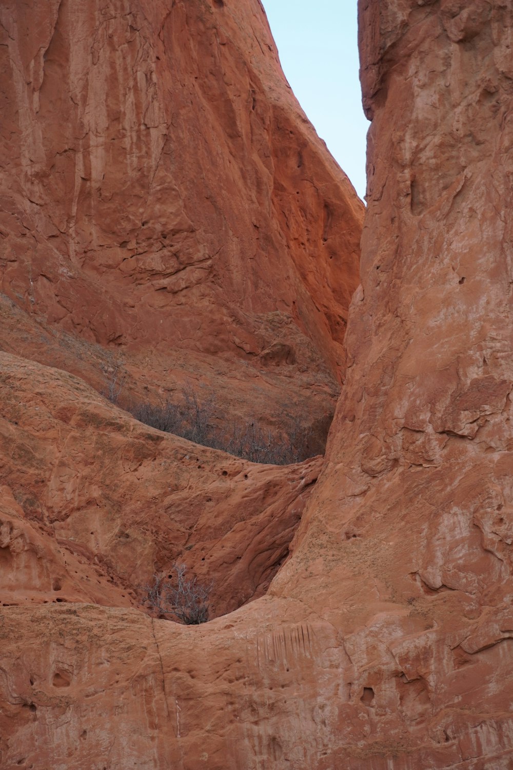 a man riding a horse through a canyon