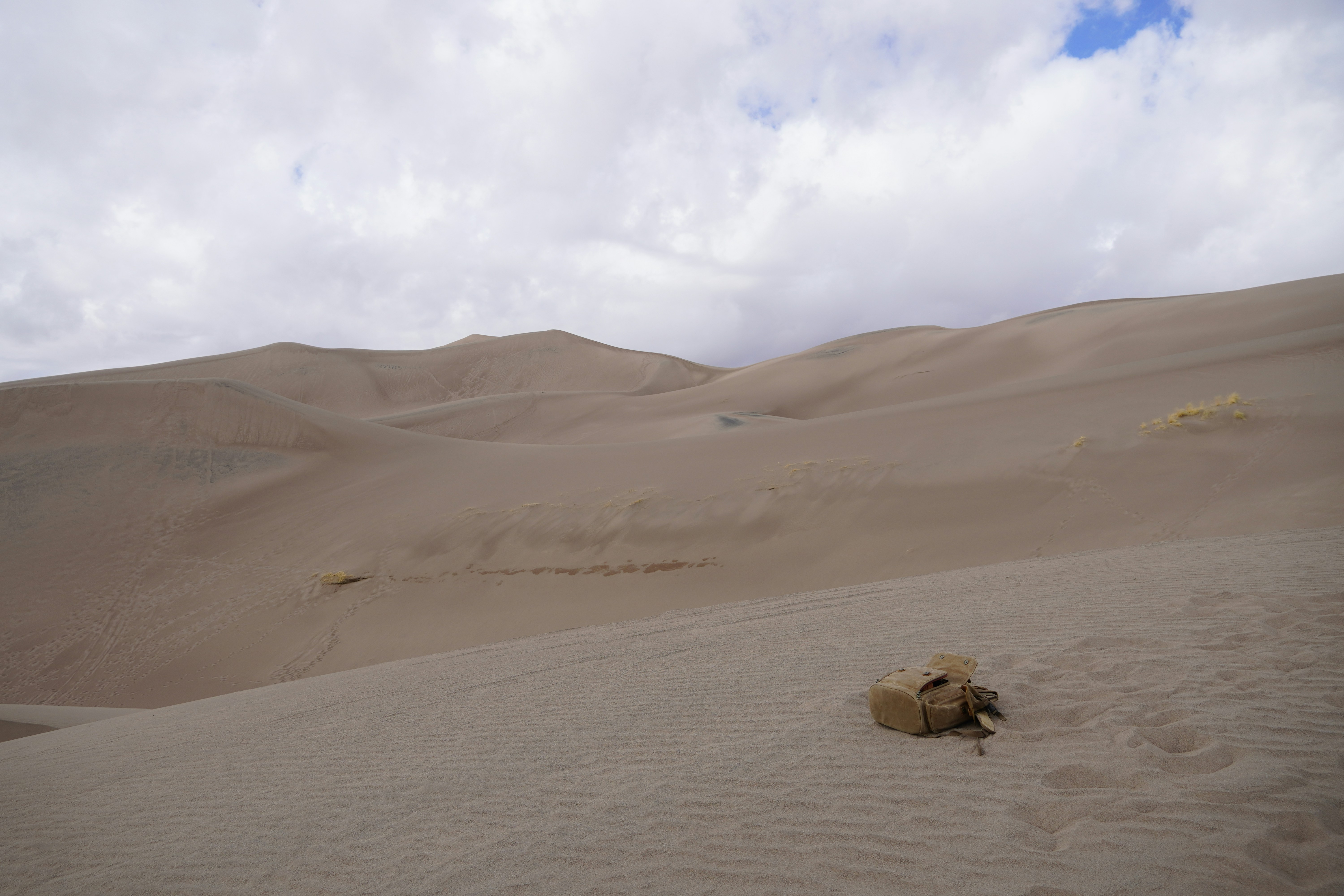 Great Sand Dunes, USA - climbed up a massive sand dune in colorado and took this on a whim. somehow, i actually really liked how it turned out. that canvas bag is actually my camera bag/backpack lol.