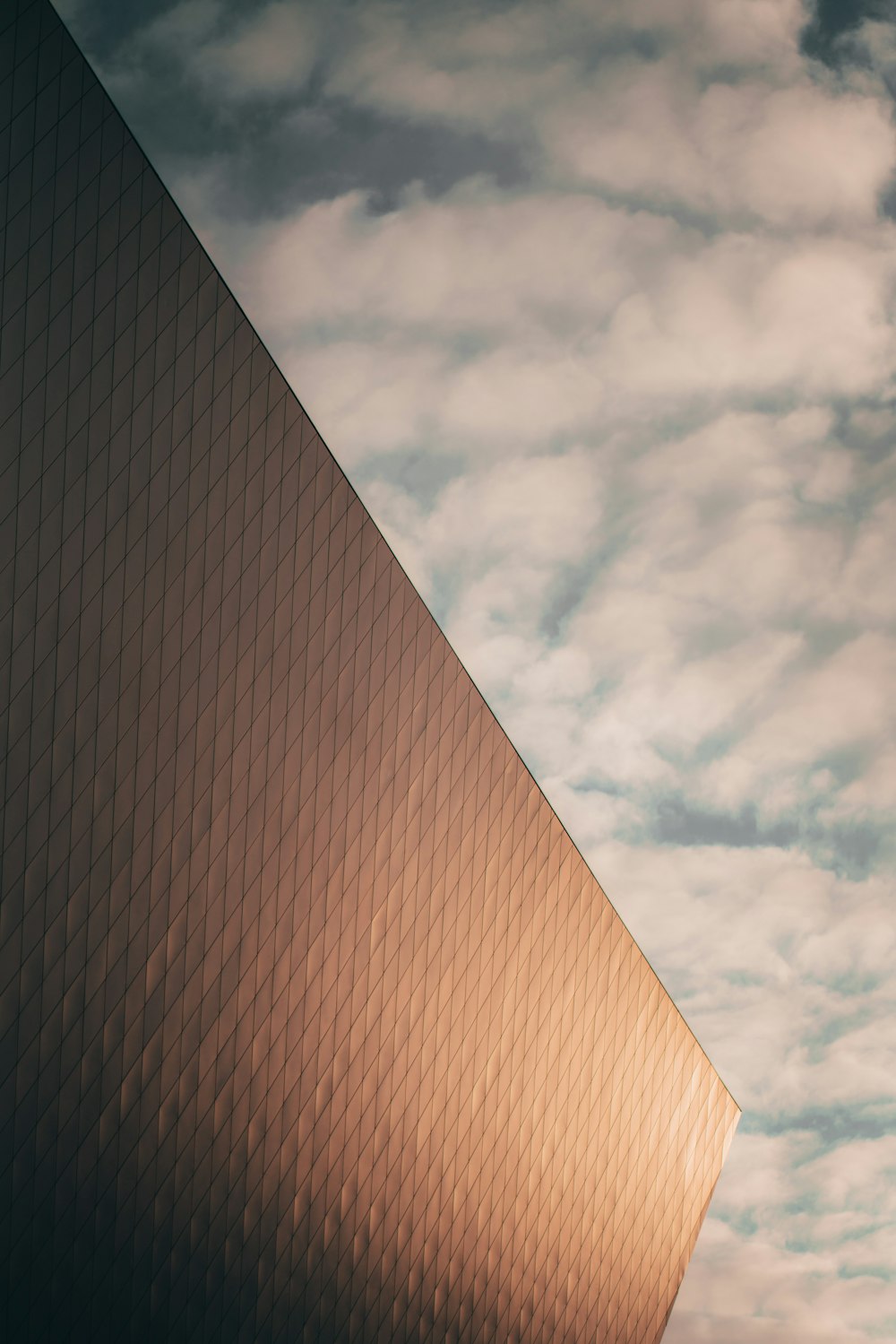 a tall building with a sky background