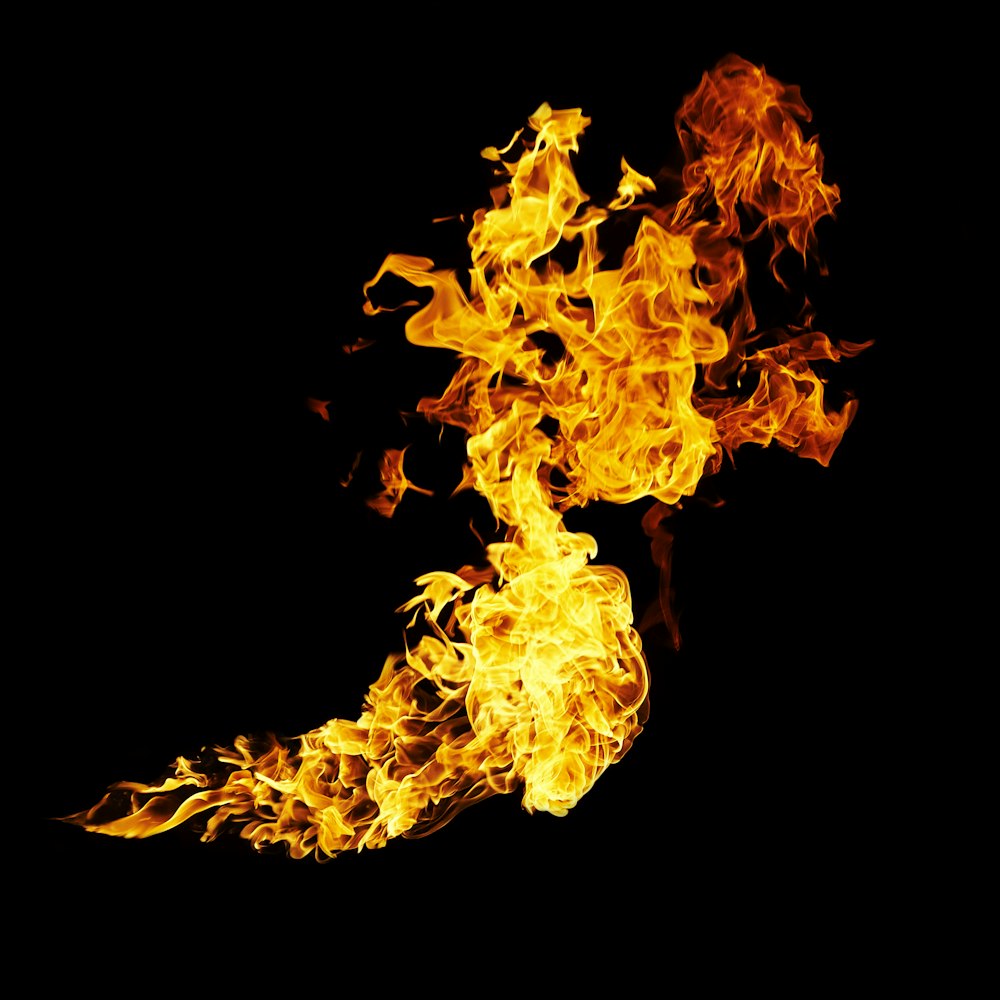 a close up of a fire on a black background