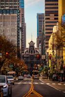 a city street filled with traffic and tall buildings