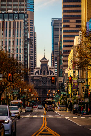 a city street filled with traffic and tall buildings