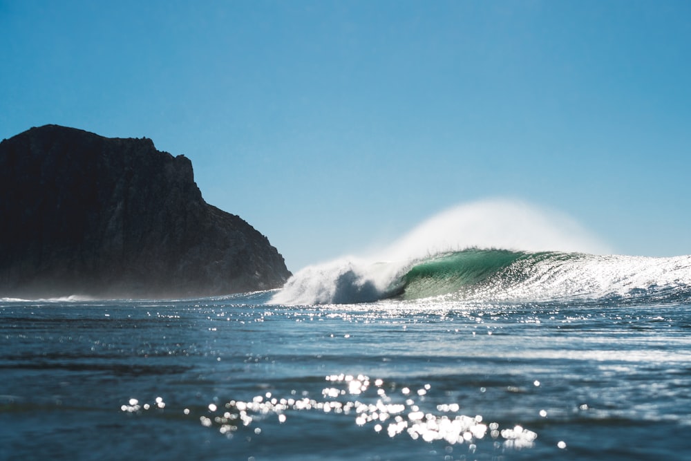 a large wave is coming towards the shore