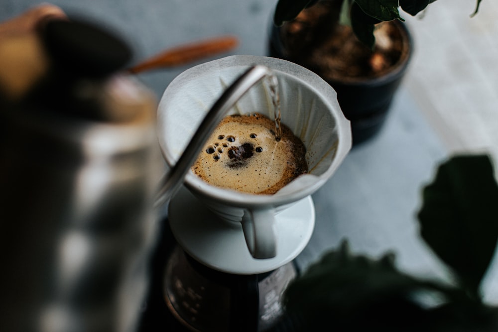 a cup of coffee with a dog on it