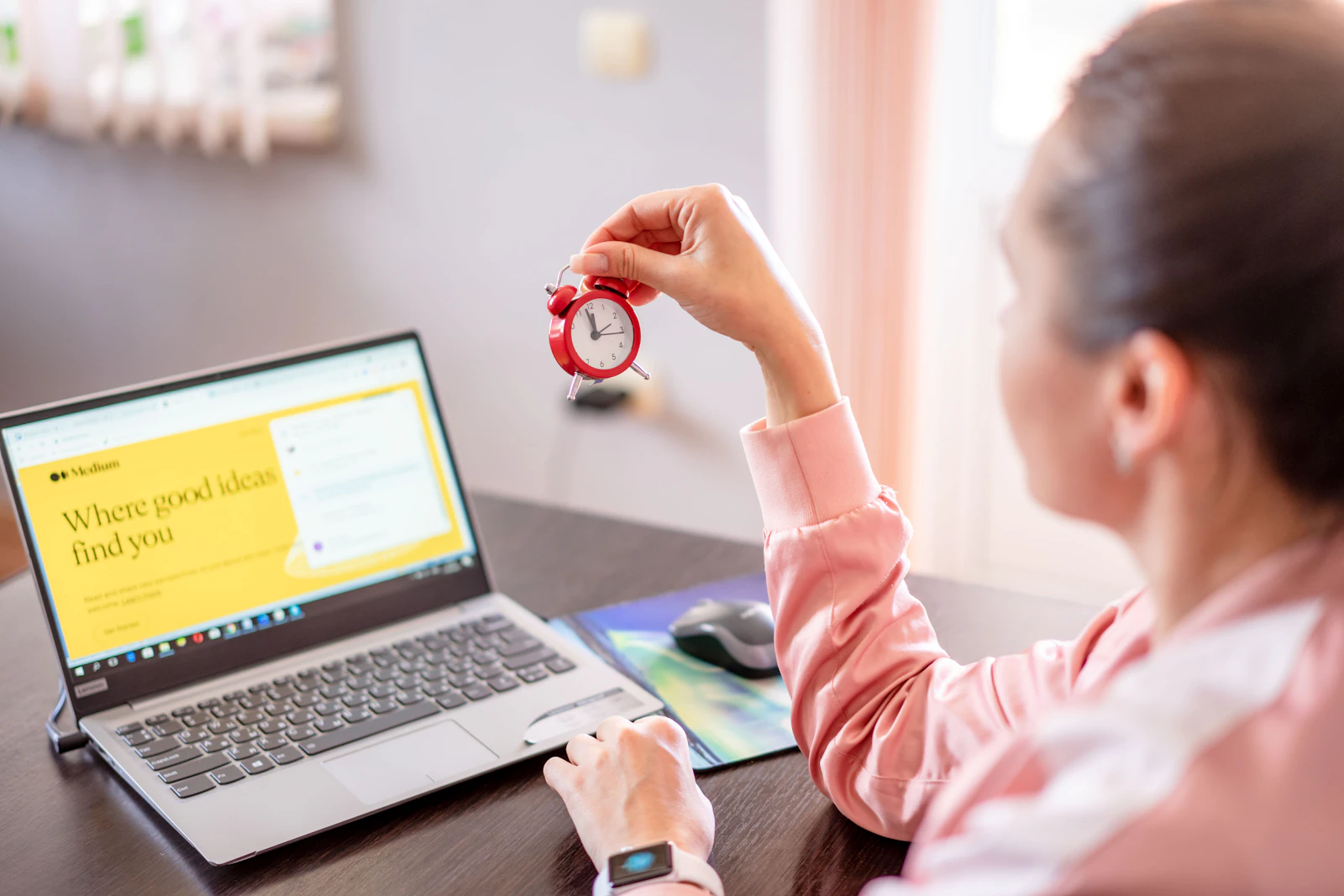 A candidate sitting a timed IELTS practice test on a laptop