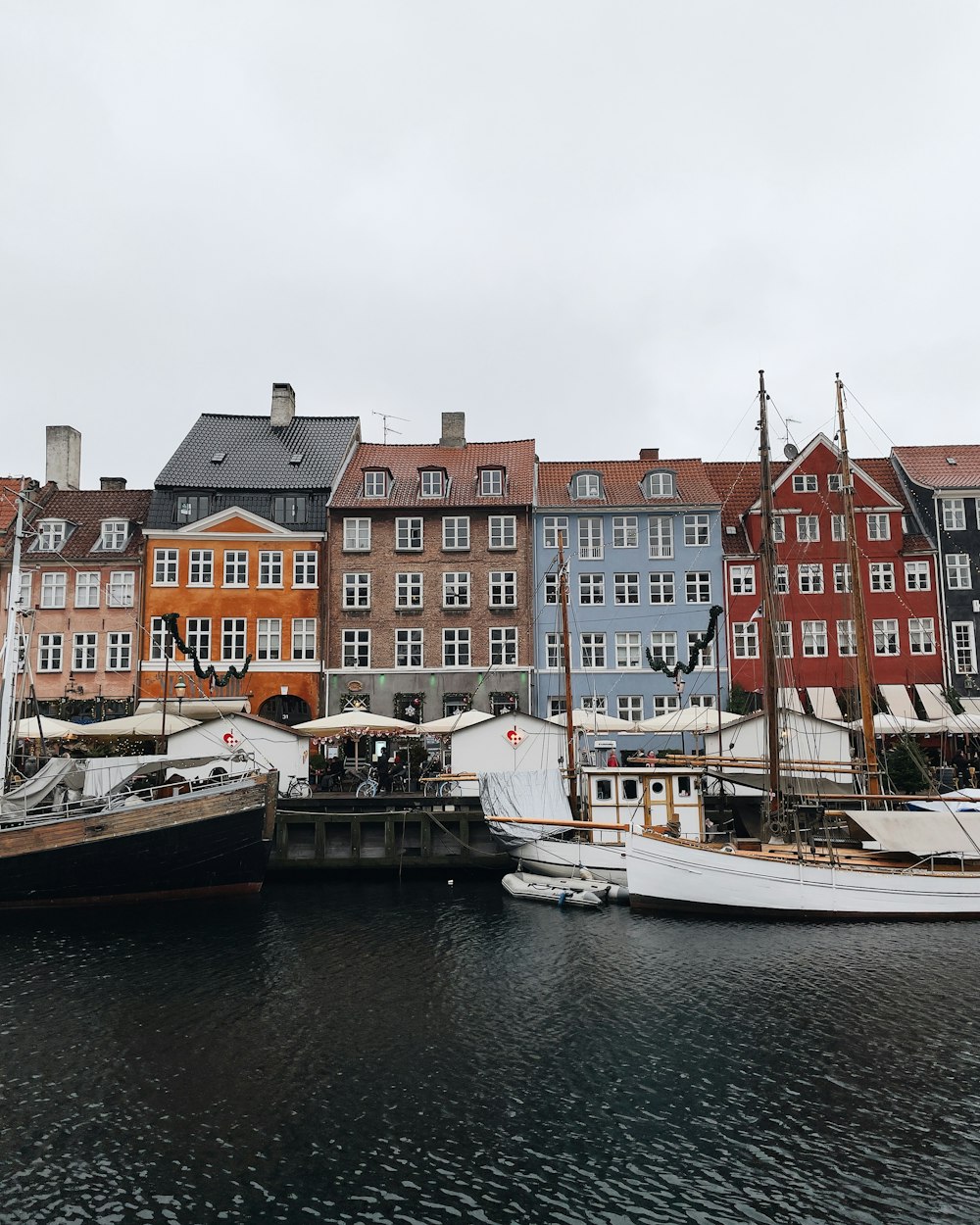 a group of boats that are sitting in the water