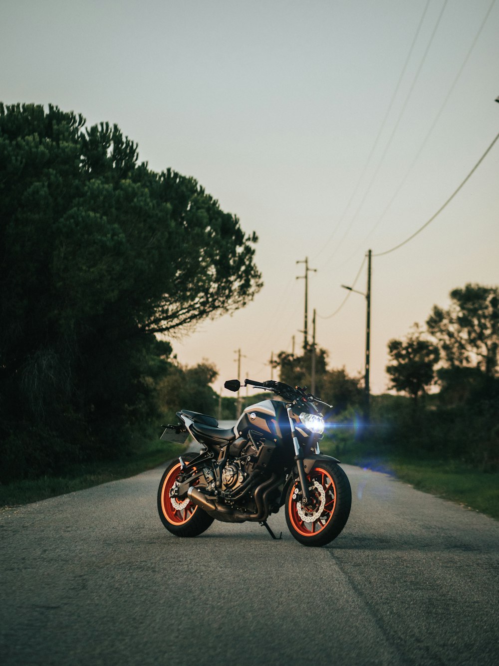 a motorcycle parked on the side of a road