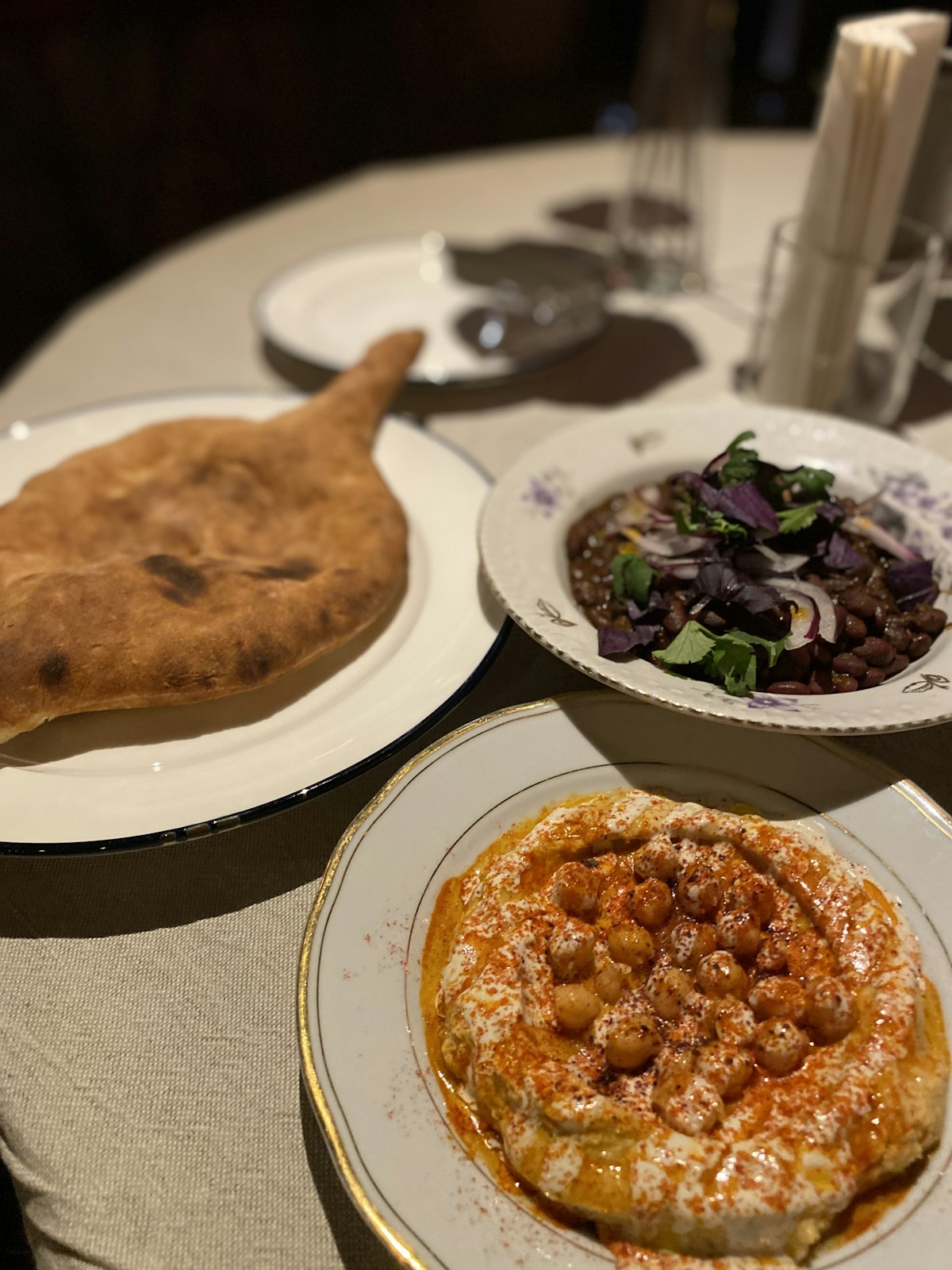 An Albanian table with shared plates and bread