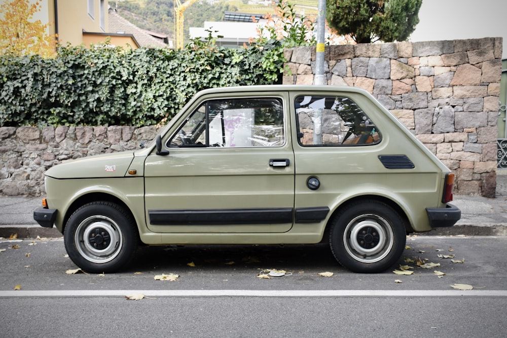 a small car parked on the side of the road