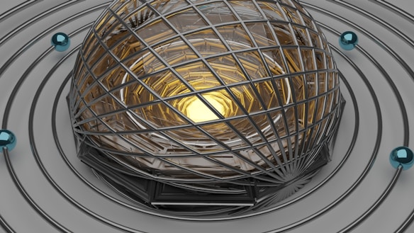 A futuristic and abstract structure featuring a spherical cage of metallic, lattice-like bars encasing a glowing golden core. The entire setup is surrounded by concentric circular tracks, each adorned with small, glossy blue spheres.