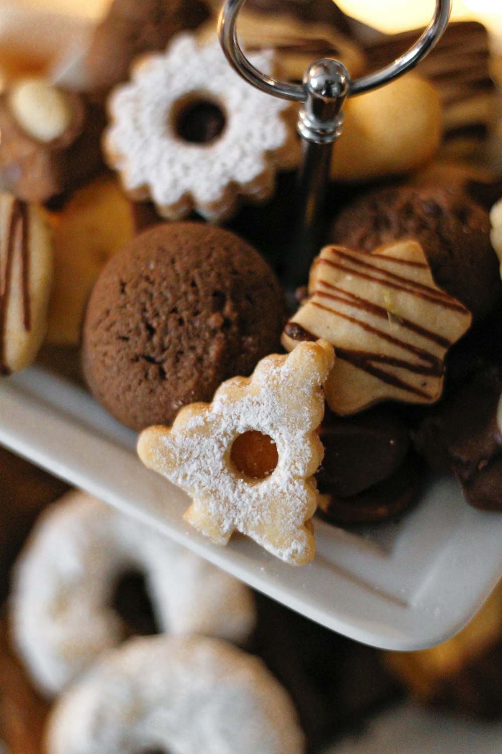 a white plate topped with lots of different types of donuts