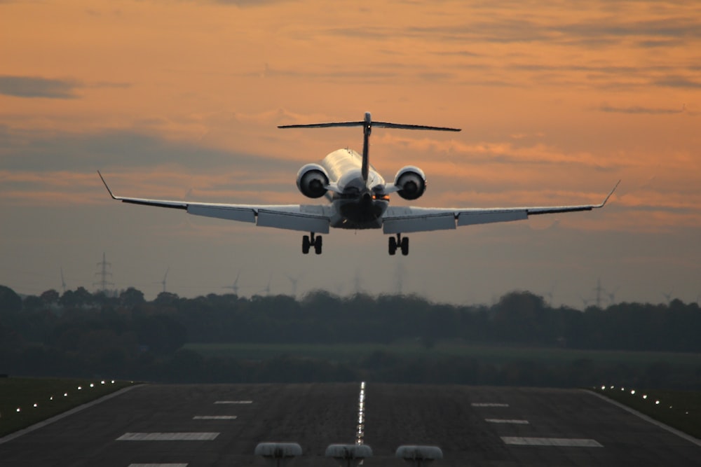 an airplane taking off from an airport runway