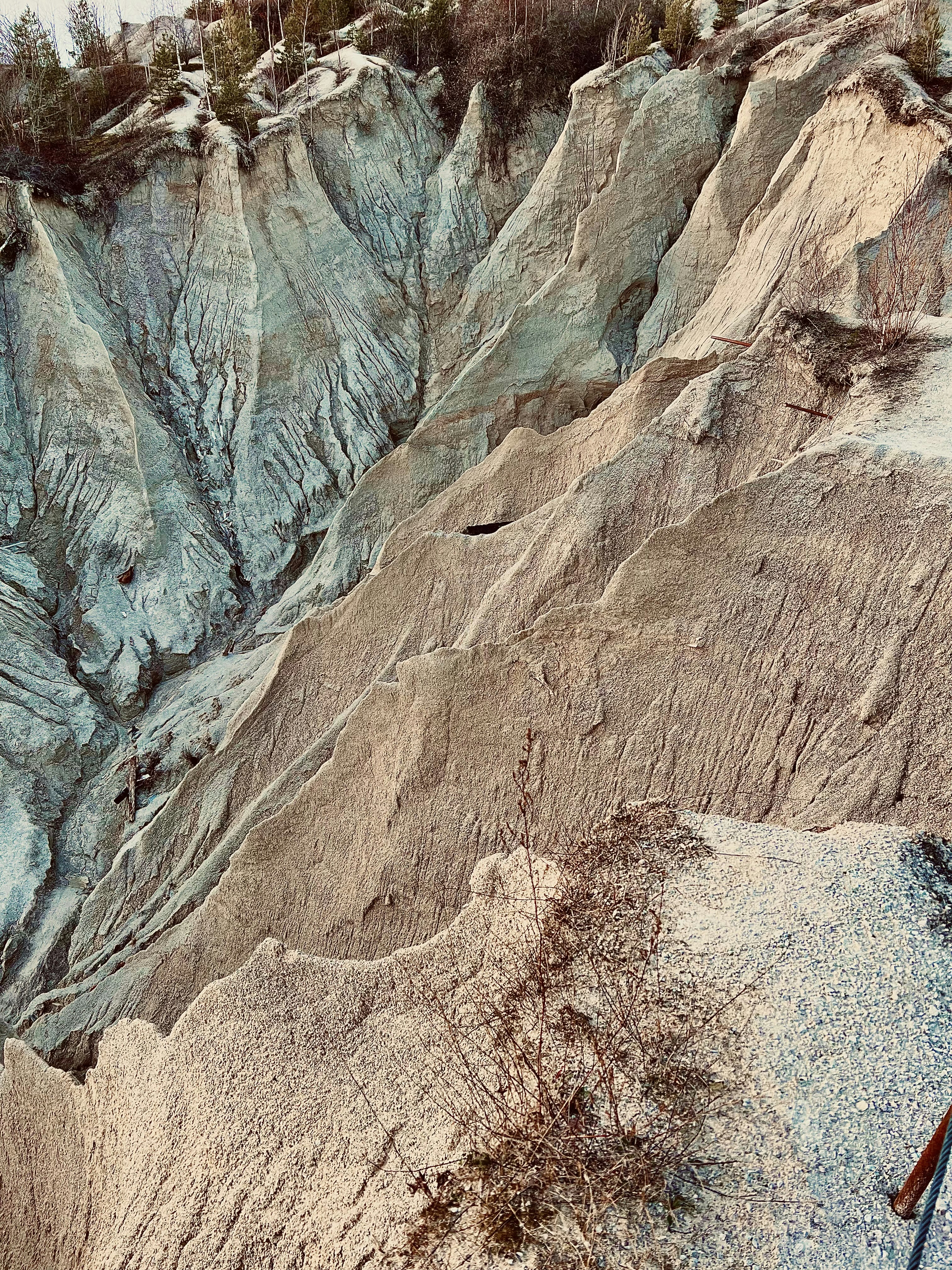 a man standing on top of a snow covered slope