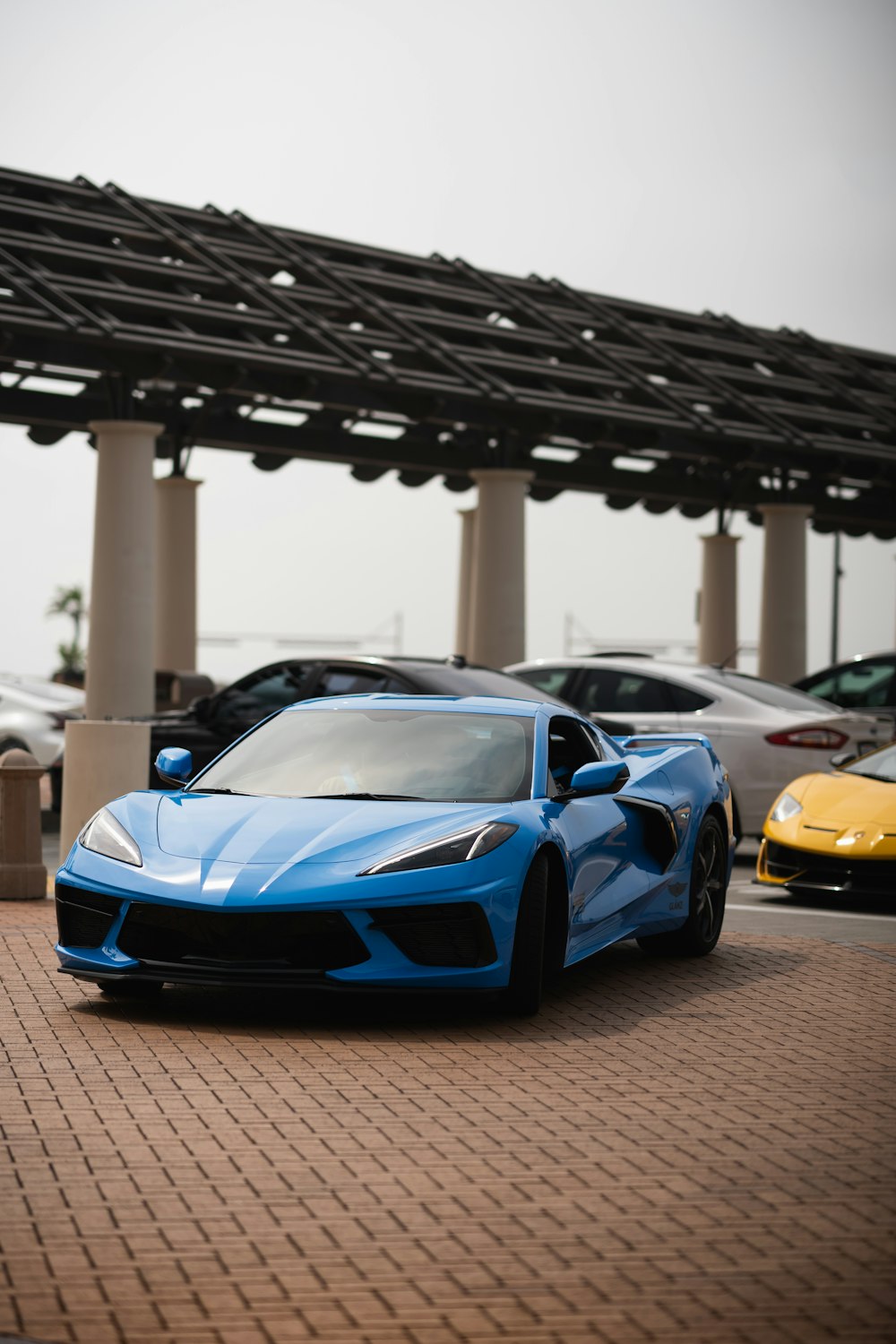 a blue sports car parked in a parking lot