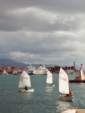 A sailing workshop in progress with learners discussing tech concepts aboard a yacht.