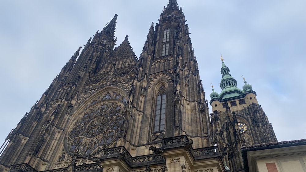 a very tall cathedral with a clock on it's side