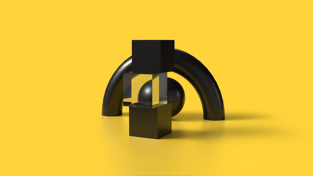a black object on a yellow background