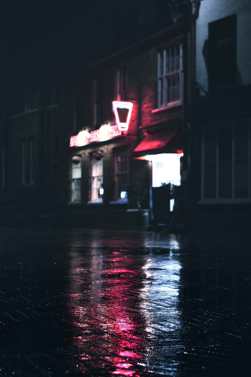 a building with a neon sign on the side of it