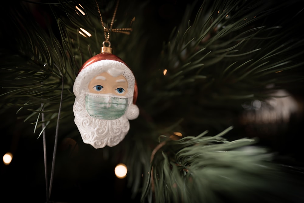 a christmas ornament hanging from a christmas tree