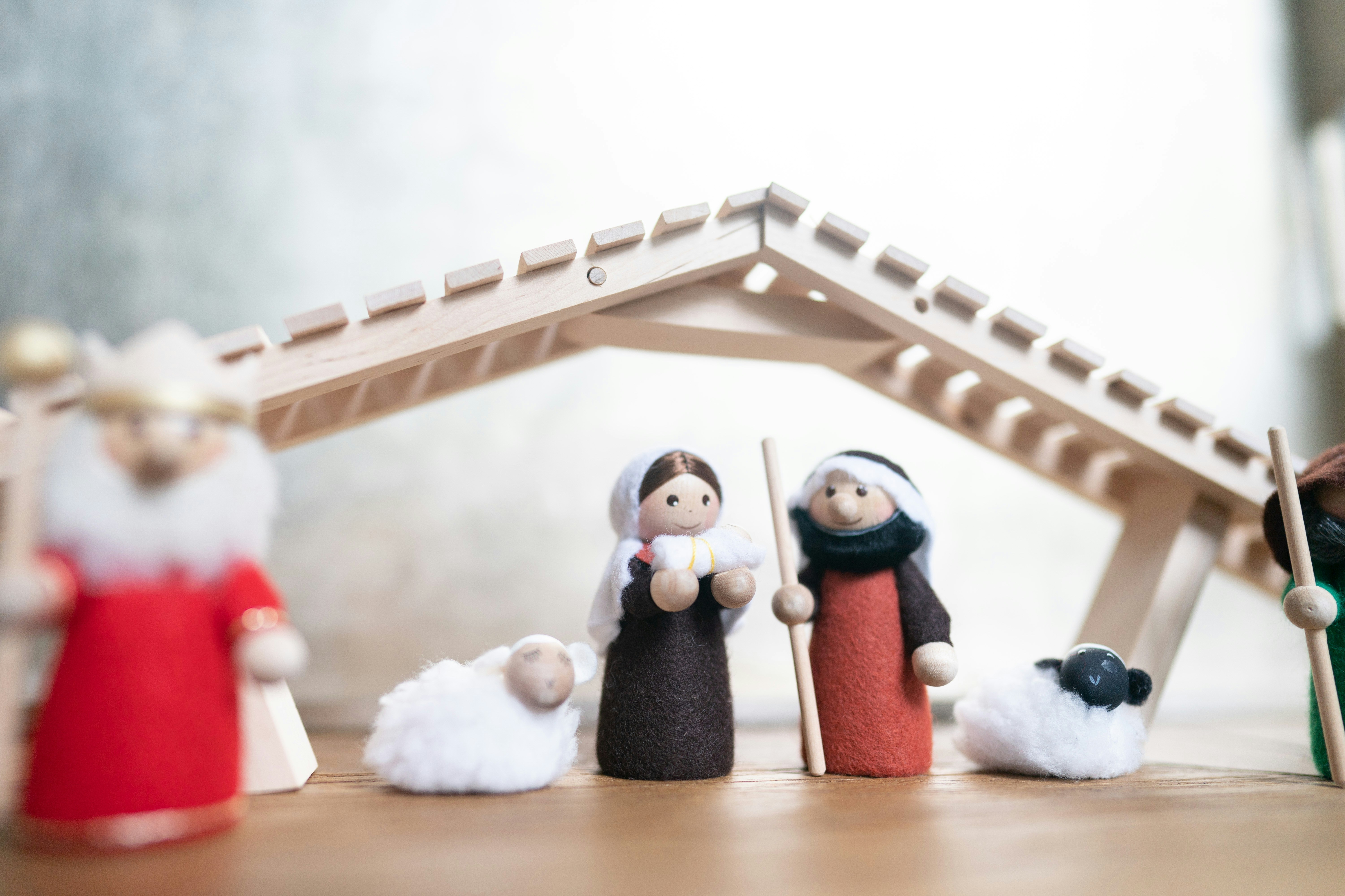 A nativity scene with figurines of people and animals photo Free