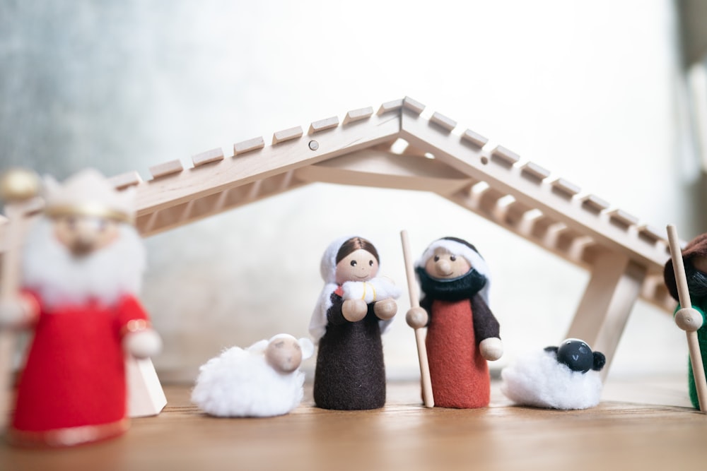 a nativity scene with figurines of people and animals