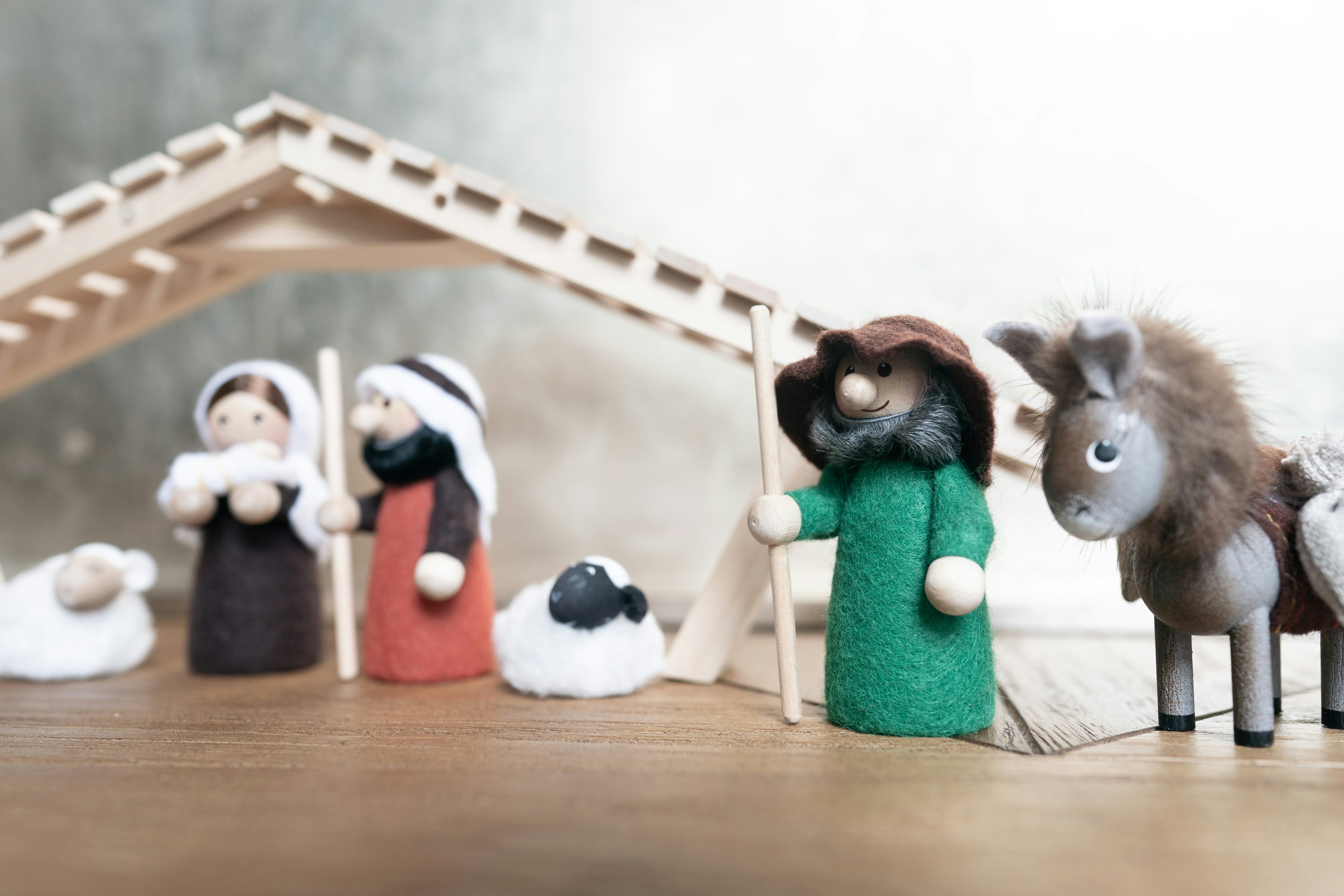 A nativity scene with figurines of people and animals photo Free