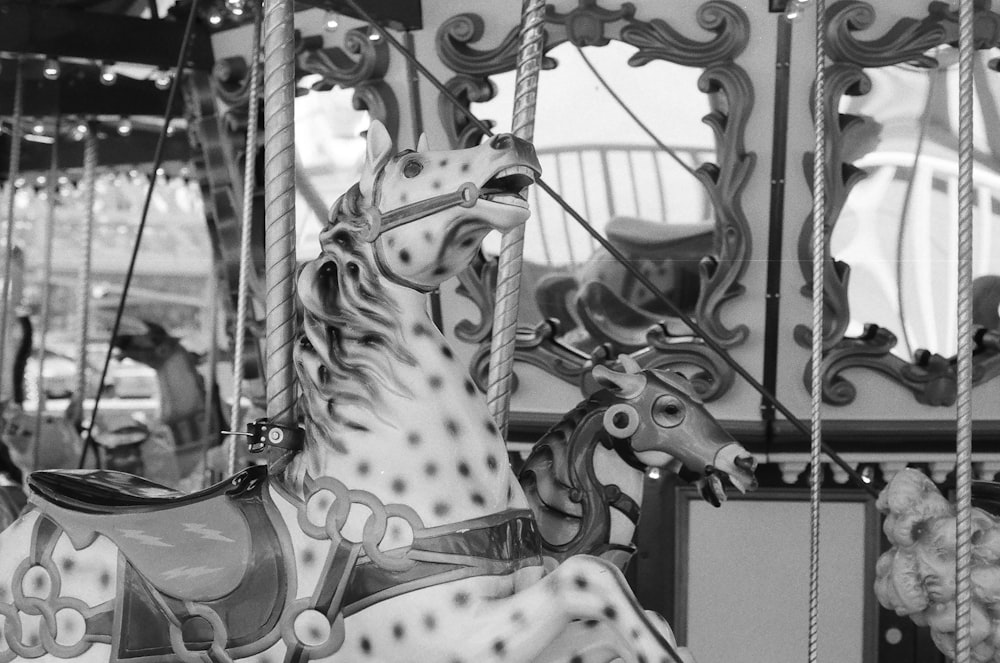 a black and white photo of a merry go round