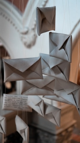 A collection of envelopes and paper clips displayed with artistic flair.