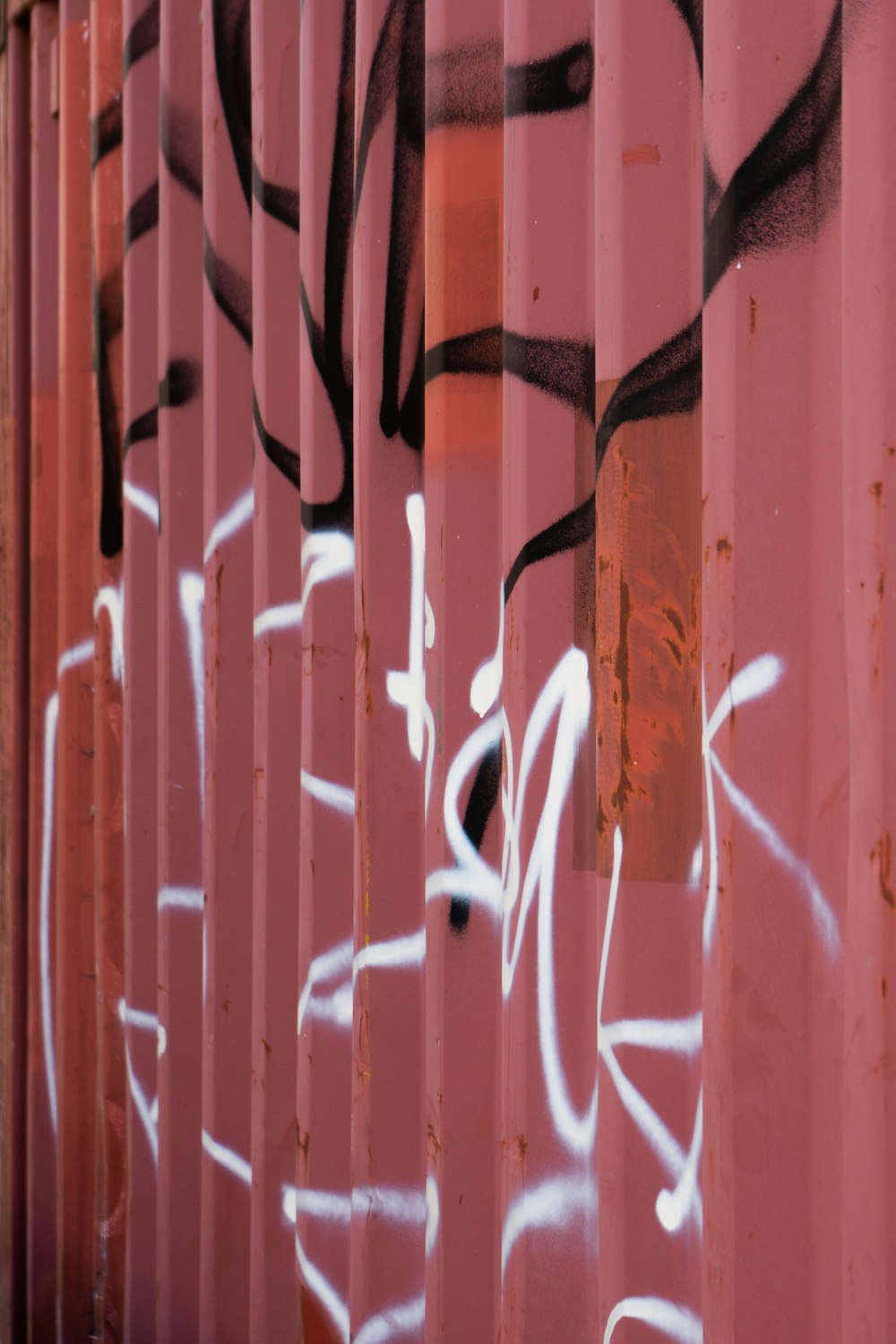 a close up of a wall with graffiti on it