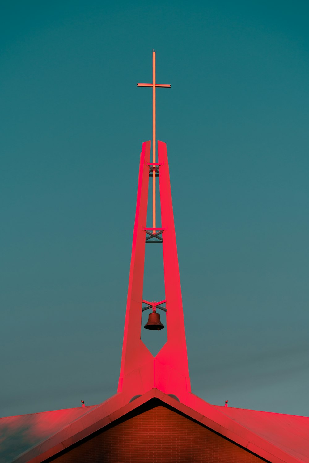 a church steeple with a cross on top