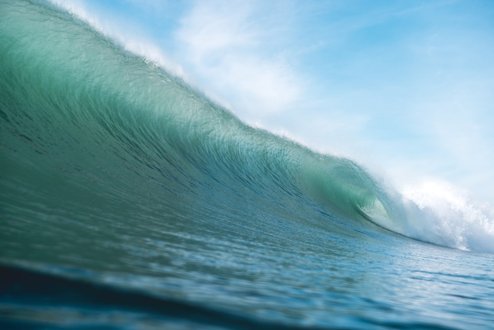 a large wave in the middle of the ocean