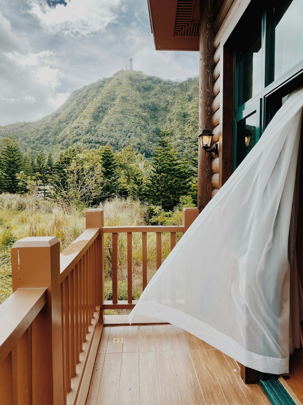 a view of a mountain from a porch