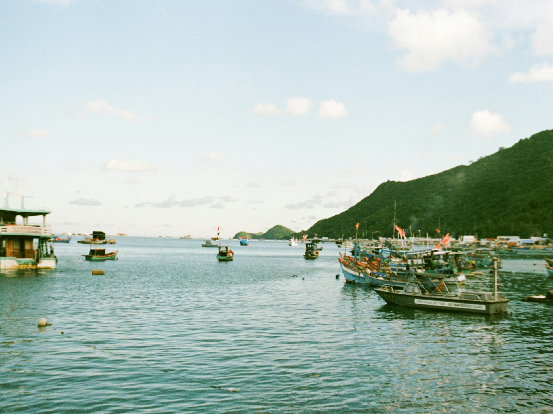 woman wearing yellow long-sleeved dress under white clouds and blue sky during daytime