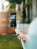 a person holding a cell phone up to a camera