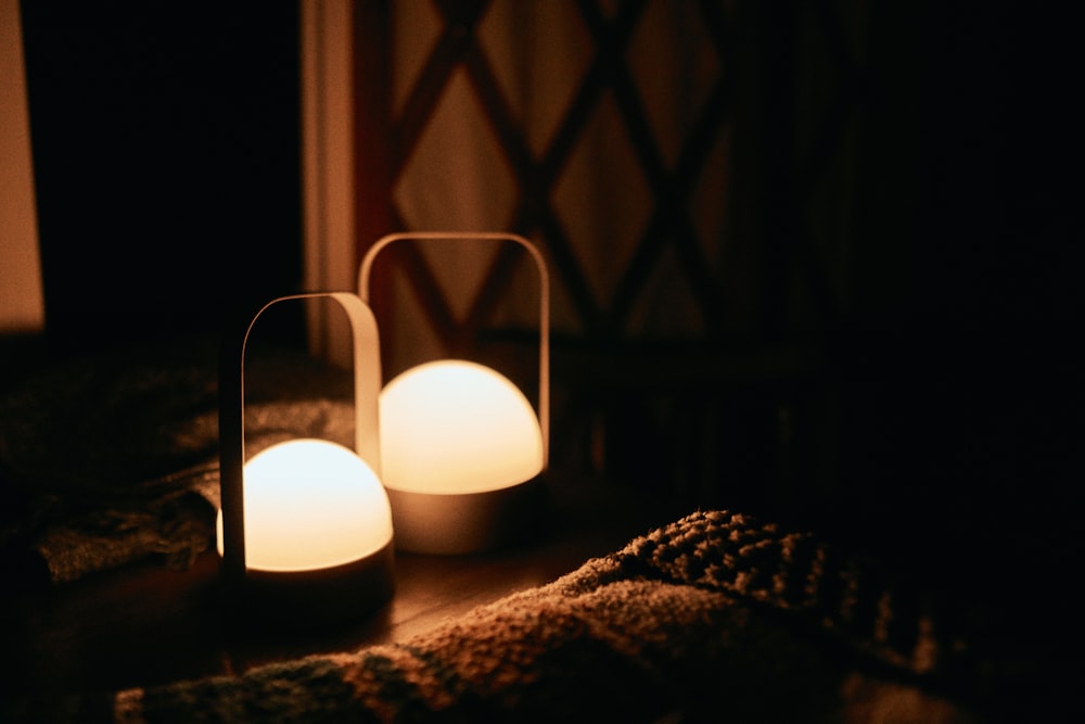 a couple of lights that are on a table