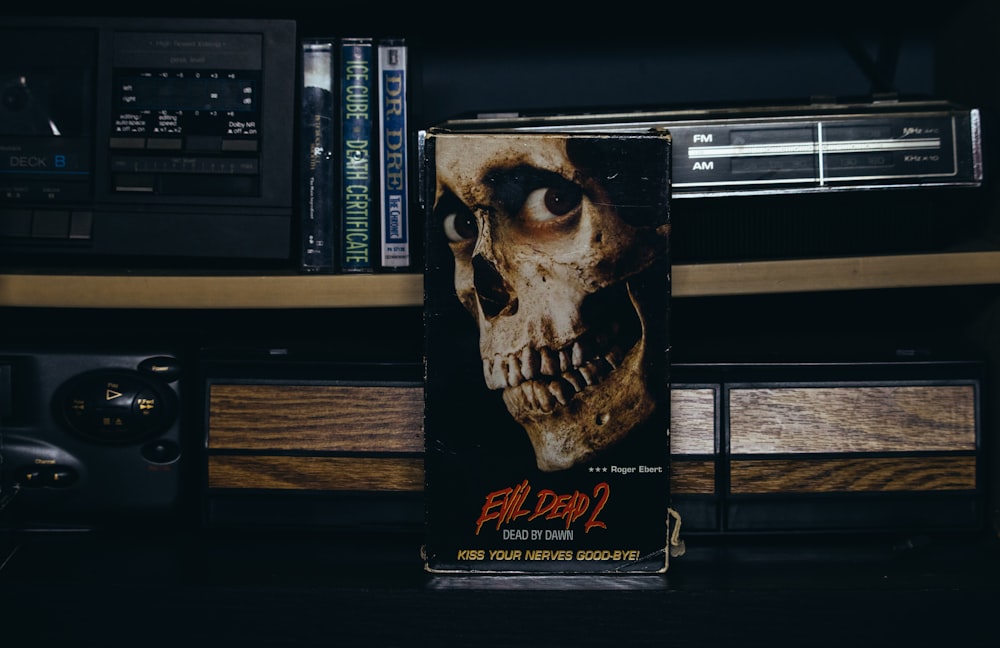 a book sitting on top of a table next to a radio