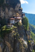 a cliff with a building on top of it