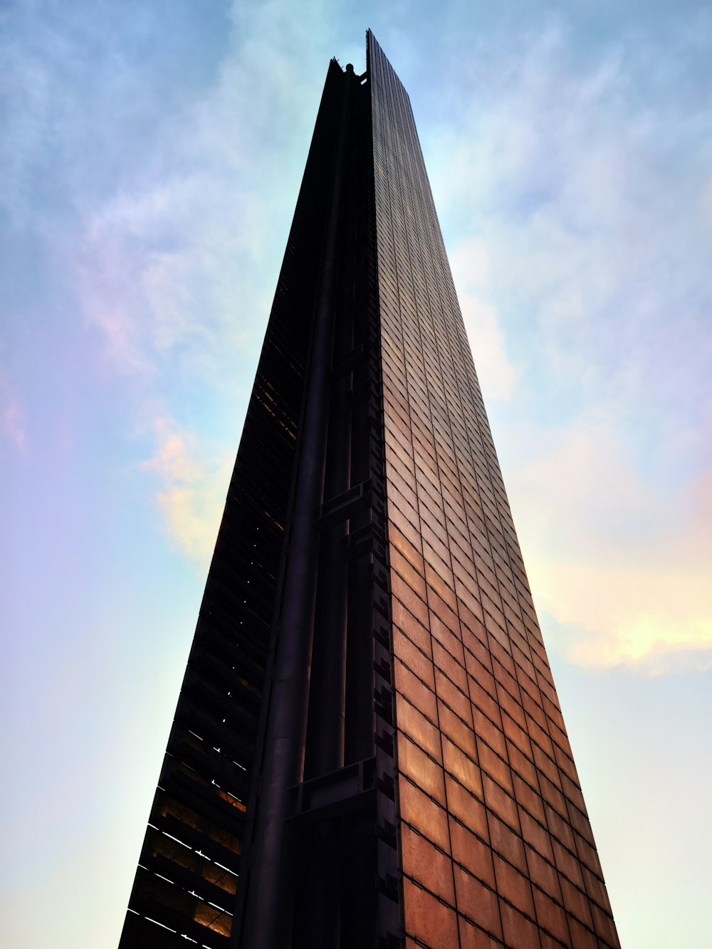 a very tall building with a sky in the background