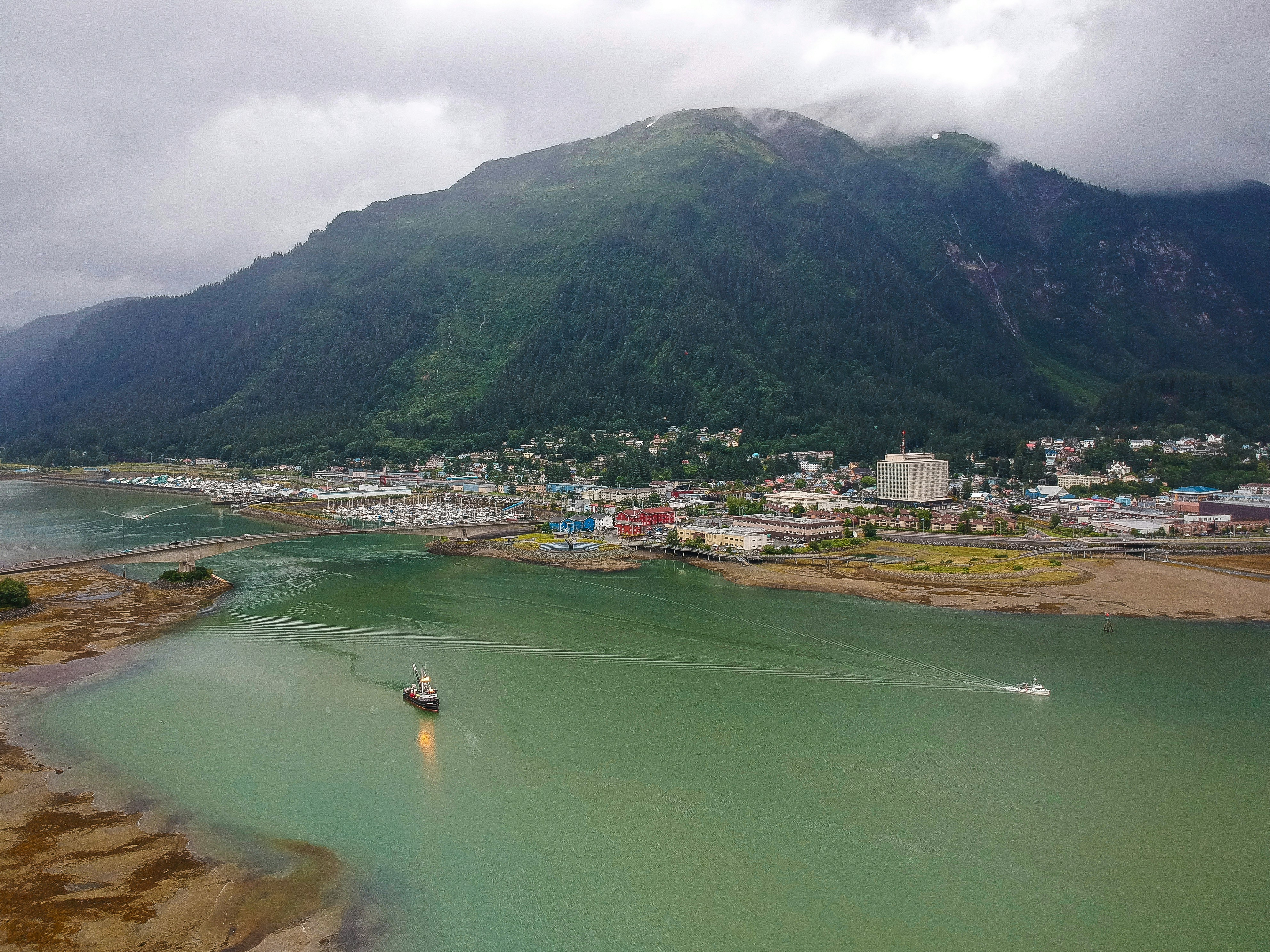 an aerial view of a small boat in a body of water