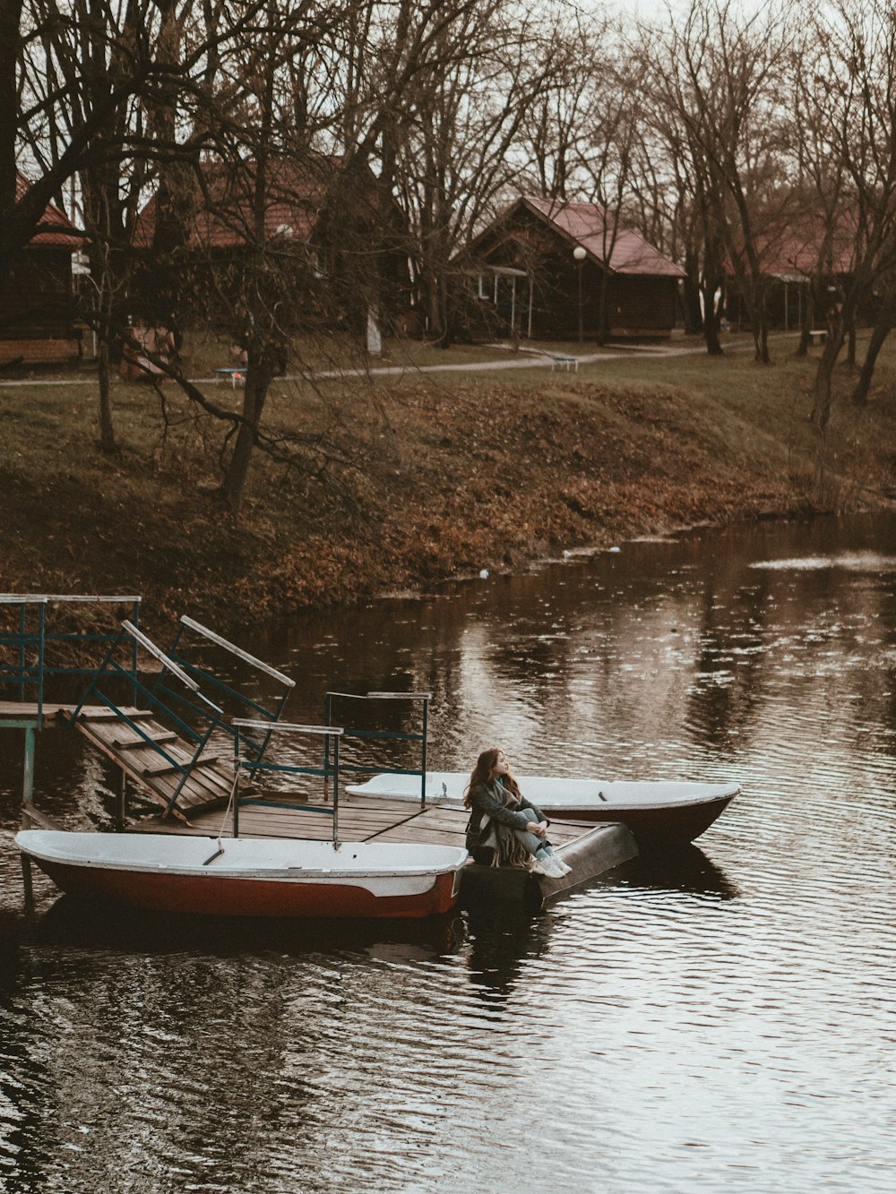 a person sitting on a boat in a body of water