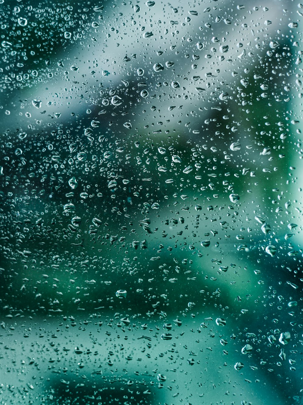 a close up of a window with rain drops