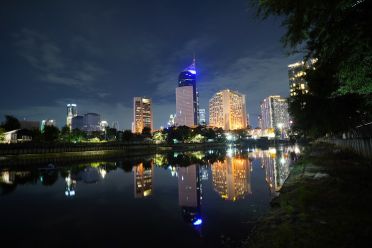a view of a city at night from across a river