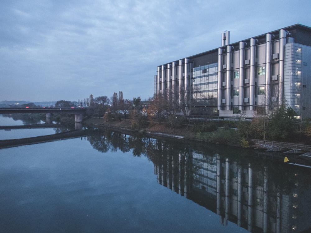 a large building next to a body of water