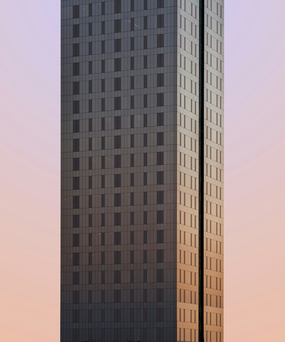 a tall building with a sky background