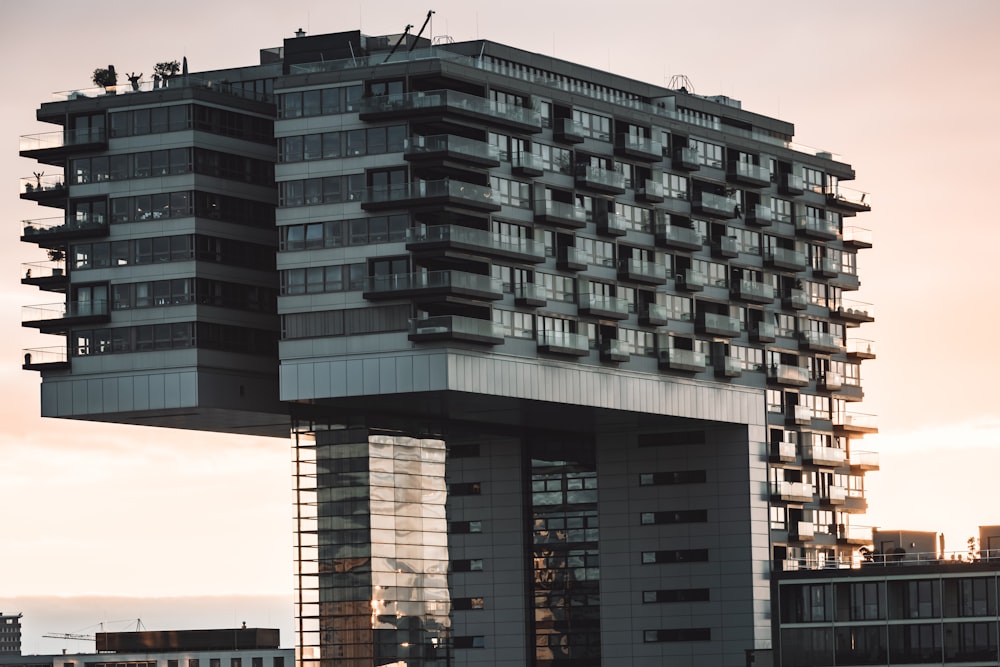 a tall building with balconies on top of it