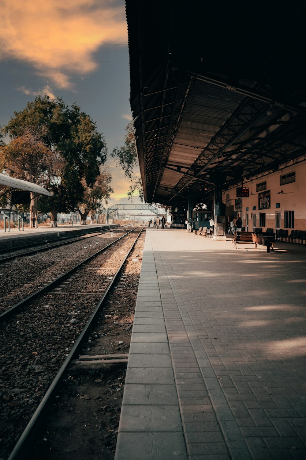 a train station with a train on the tracks