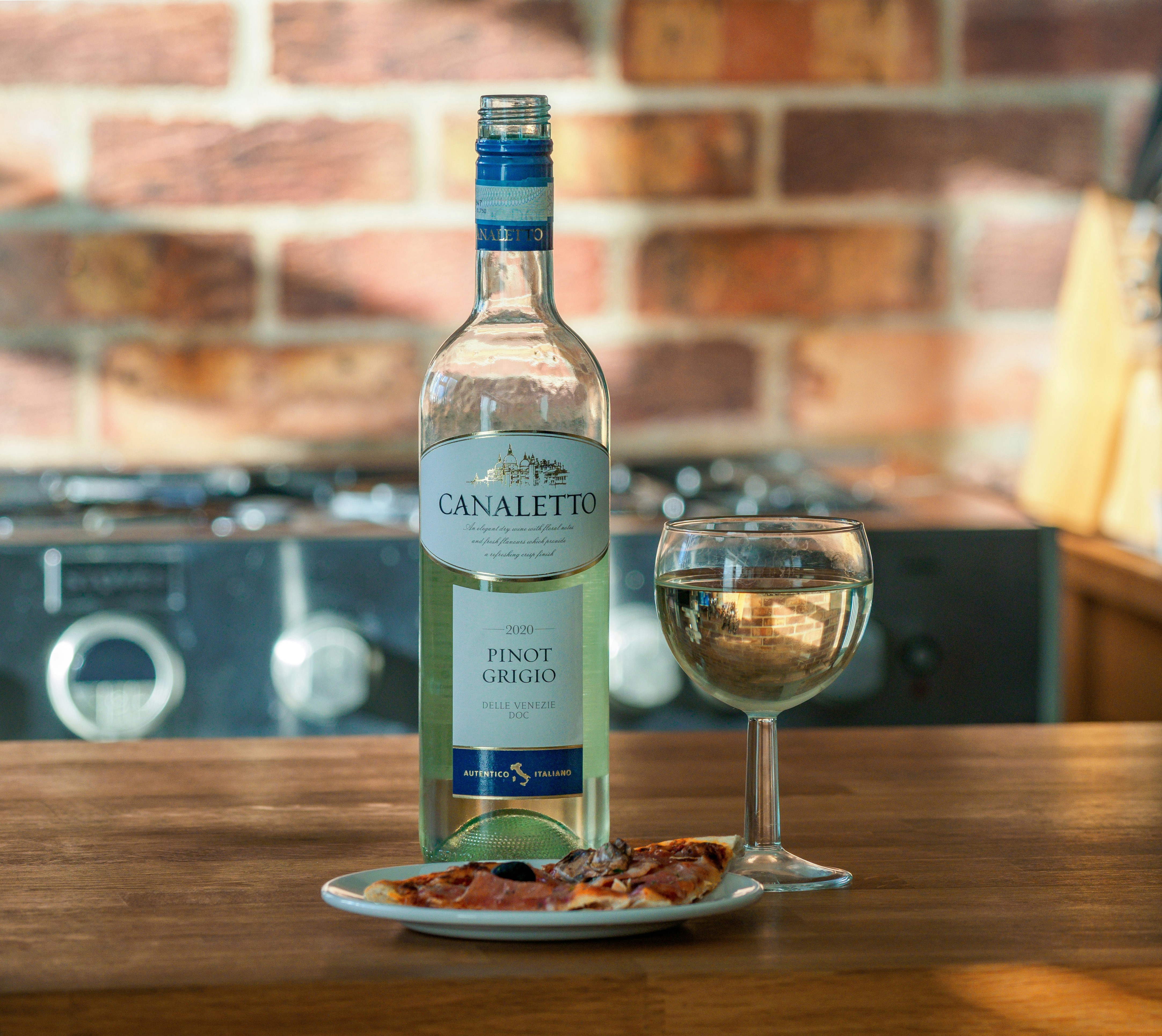 a bottle of wine and a glass on a table